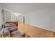 Bright living room with hardwood floors, neutral walls, and ample natural light from large windows at 6207 Robinson Church Rd, Charlotte, NC 28215