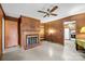 Cozy living room with wood paneling, a fireplace, and built-in shelves at 6207 Robinson Church Rd, Charlotte, NC 28215
