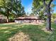 Back of home with large backyard and mature trees at 6208 Charlie Walker Rd, Kannapolis, NC 28081