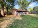 Large backyard with mature trees and wooden fence at 6208 Charlie Walker Rd, Kannapolis, NC 28081