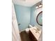 Well-lit bathroom featuring modern fixtures, including a stylish vanity and mirror at 6208 Charlie Walker Rd, Kannapolis, NC 28081
