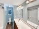 Updated bathroom with decorative tile, large mirror and modern sink at 6208 Charlie Walker Rd, Kannapolis, NC 28081