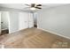 Spacious bedroom with ample closet space, neutral walls, and new flooring, offering a cozy retreat at 6208 Charlie Walker Rd, Kannapolis, NC 28081