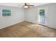 Bright bedroom with a door to the backyard, providing easy access to outdoor living spaces at 6208 Charlie Walker Rd, Kannapolis, NC 28081