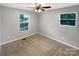 Bright bedroom with large windows, neutral walls, and new flooring, offering a clean and airy space at 6208 Charlie Walker Rd, Kannapolis, NC 28081