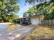 Charming single-Gathering home with a driveway and a well-maintained front lawn at 6208 Charlie Walker Rd, Kannapolis, NC 28081