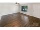 Bright living room with large windows and new floors, offering ample natural light at 6208 Charlie Walker Rd, Kannapolis, NC 28081