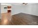 Open living room area featuring hardwood floors leading to kitchen area at 6208 Charlie Walker Rd, Kannapolis, NC 28081