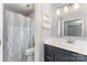 Bathroom includes modern vanity, a mirror, and a shower and tub combo at 706 Hammermill Ct, Charlotte, NC 28270