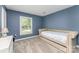 Comfortable bedroom featuring carpet, neutral colors, and natural light at 706 Hammermill Ct, Charlotte, NC 28270