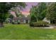 Charming home with blue shutters and a well-manicured front yard, showcasing curb appeal and inviting entrance at 706 Hammermill Ct, Charlotte, NC 28270
