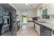 Well lit kitchen with modern appliances, bright cabinets, and lovely countertops at 706 Hammermill Ct, Charlotte, NC 28270