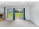 Bright and airy living space with sliding glass doors leading to a lush backyard view at 706 Hammermill Ct, Charlotte, NC 28270