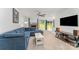 Comfortable living room with a fireplace, large windows, and modern entertainment setup at 706 Hammermill Ct, Charlotte, NC 28270