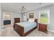 Comfortable main bedroom features natural light, ceiling fan, and carpet at 706 Hammermill Ct, Charlotte, NC 28270
