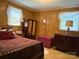 Cozy bedroom with paneled walls, classic wood furniture, and a comfortable bed at 714 E Dunlap St, Lancaster, SC 29720