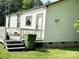 Charming home exterior with a back deck and well-maintained lawn at 714 E Dunlap St, Lancaster, SC 29720