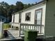 Charming home exterior with a back deck and well-maintained lawn at 714 E Dunlap St, Lancaster, SC 29720