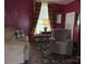 Comfortable living room with a sofa, recliner, and natural light from the window at 714 E Dunlap St, Lancaster, SC 29720