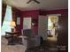 Comfortable living room with a sofa, recliner, and natural light from the window at 714 E Dunlap St, Lancaster, SC 29720