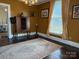 Elegant living room featuring vintage furnishings, chandelier, hardwood floors, and ample natural light at 714 E Dunlap St, Lancaster, SC 29720