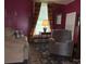 Comfortable living room with a sofa, recliner, and natural light from the window at 714 E Dunlap St, Lancaster, SC 29720