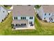 Home featuring a covered patio, manicured lawn, and well-kept lawn at 7651 Fenn Way, Fort Mill, SC 29707