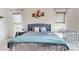 Cozy bedroom with a plush bed, bedside tables, and natural light from multiple windows at 7651 Fenn Way, Fort Mill, SC 29707