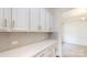 A well-appointed butler's pantry features stylish cabinets, countertops, and ample storage space at 7651 Fenn Way, Fort Mill, SC 29707