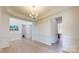 Elegant dining room showcases classic wainscoting, hardwood floors, and decorative lighting at 7651 Fenn Way, Fort Mill, SC 29707