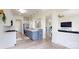 Modern kitchen with stainless steel appliances, white cabinets, and a large island for entertaining at 7651 Fenn Way, Fort Mill, SC 29707