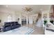 Open-concept design showcasing the living room, dining area, staircase, and kitchen with seamless flow at 7651 Fenn Way, Fort Mill, SC 29707