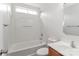 Bathroom showcasing a tub with tile surround, modern vanity, and neutral color scheme at 7806 Mcgarry Trl, Charlotte, NC 28214