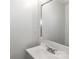 Bathroom featuring a sleek vanity with sink, mirror, and neutral-toned walls at 7806 Mcgarry Trl, Charlotte, NC 28214