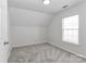 Well-lit bedroom with neutral carpet and a window providing natural light at 7806 Mcgarry Trl, Charlotte, NC 28214
