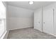 Neutral bedroom with carpet, closet, and ample natural light from the window at 7806 Mcgarry Trl, Charlotte, NC 28214