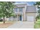 Charming two-story home with blue shutters and a covered front porch at 7806 Mcgarry Trl, Charlotte, NC 28214