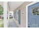 Inviting covered front porch with white railings and the house address at 7806 Mcgarry Trl, Charlotte, NC 28214