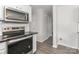 Modern kitchen with stainless steel appliances ready for cooking and dining at 7806 Mcgarry Trl, Charlotte, NC 28214