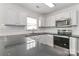 Modern kitchen design featuring sleek countertops, stainless steel appliances, and ample cabinet storage at 7806 Mcgarry Trl, Charlotte, NC 28214