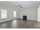 Spacious living room boasting wood floors and a cozy fireplace for relaxing evenings at 7806 Mcgarry Trl, Charlotte, NC 28214