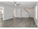 Spacious living room with modern flooring, a ceiling fan, and neutral walls at 7806 Mcgarry Trl, Charlotte, NC 28214