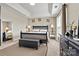 This is a staged bedroom with a large bed, carpet, lamps, art and a tray ceiling at 8002 Mariners Pointe Cir, Denver, NC 28037