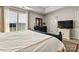 This bedroom has large windows, a dresser and a TV on top of another cabinet at 8002 Mariners Pointe Cir, Denver, NC 28037