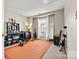 Bonus room or bedroom with desk, workout equipment, rug, mirror and natural light at 8002 Mariners Pointe Cir, Denver, NC 28037