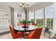 Bright dining area with a round table, seating for four, and natural light at 8002 Mariners Pointe Cir, Denver, NC 28037