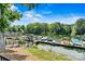 Picturesque view of the community boat docks surrounded by lush trees, offering convenient lake access at 8002 Mariners Pointe Cir, Denver, NC 28037