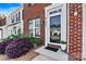 Close-up of the front door, showcasing the brick exterior and well-maintained landscaping at 8002 Mariners Pointe Cir, Denver, NC 28037