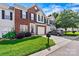 Charming townhome featuring a brick facade, well-maintained lawn, and a one-car garage at 8002 Mariners Pointe Cir, Denver, NC 28037