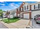 Beautiful townhome with a brick and siding exterior, neat landscaping, and attached garage at 8002 Mariners Pointe Cir, Denver, NC 28037